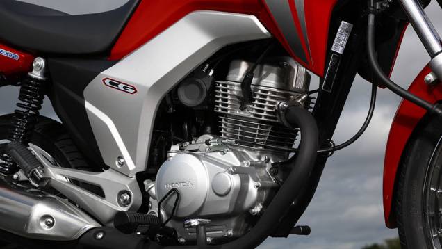 A linha CG 150 apresenta o motor OHC de 149,2 cm³ e quatro tempos com sistema Flex | <a href="https://quatrorodas.abril.com.br/moto/noticias/honda-lanca-cg-2014-totalmente-renovada-748587.shtml" rel="migration">Leia mais</a>