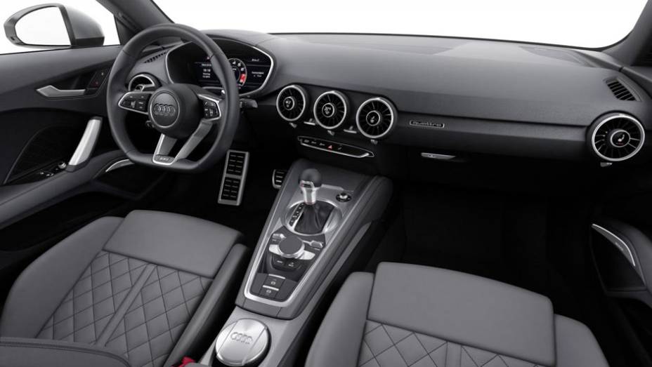 Internamente, o novo TT é equipado com volante de base achatada, display de informações de 12,3 polegadas... | <a href="https://quatrorodas.abril.com.br/noticias/saloes/genebra-2014/audi-apresenta-novo-tt-775222.shtml" rel="migration">Leia mais</a>