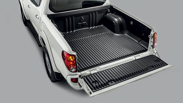 A capacidade de carga é de 1 095 kg. | <a href="https://quatrorodas.abril.com.br/carros/testes/mitsubishi-l200-triton-764187.shtml" rel="migration">Leia mais</a> A capacidade de carga é de 1 095 kg. | <a href="https://quatrorodas.abril.com.br/carros/testes/mitsubishi-l200-triton-764187.shtml" rel="migration">Leia mais</a>