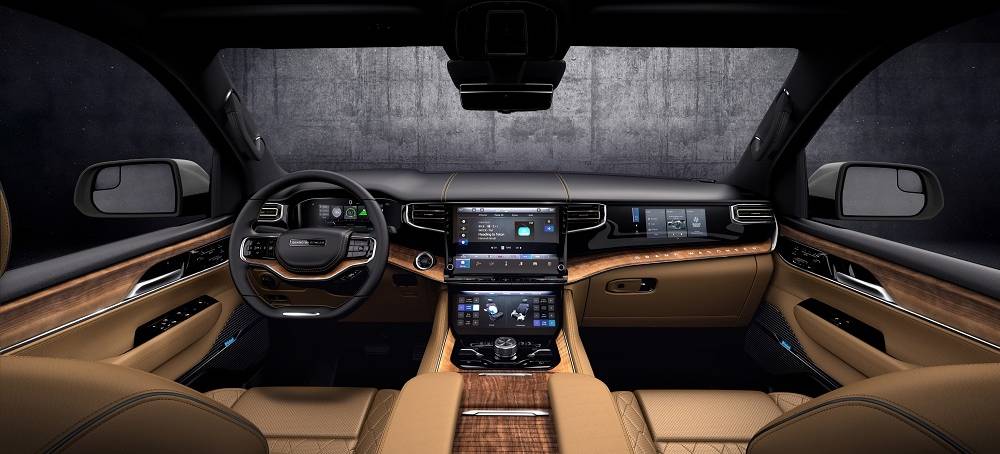 All-new 2022 Grand Wagoneer features the pinnacle of premium SUV interiors (seen here in Tupelo) with a modern American style and Uconnect 5 12-inch touchscreen radio.